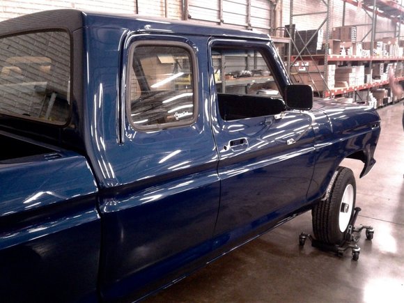 Side profile view during final assembly showcasing SuperCab configuration